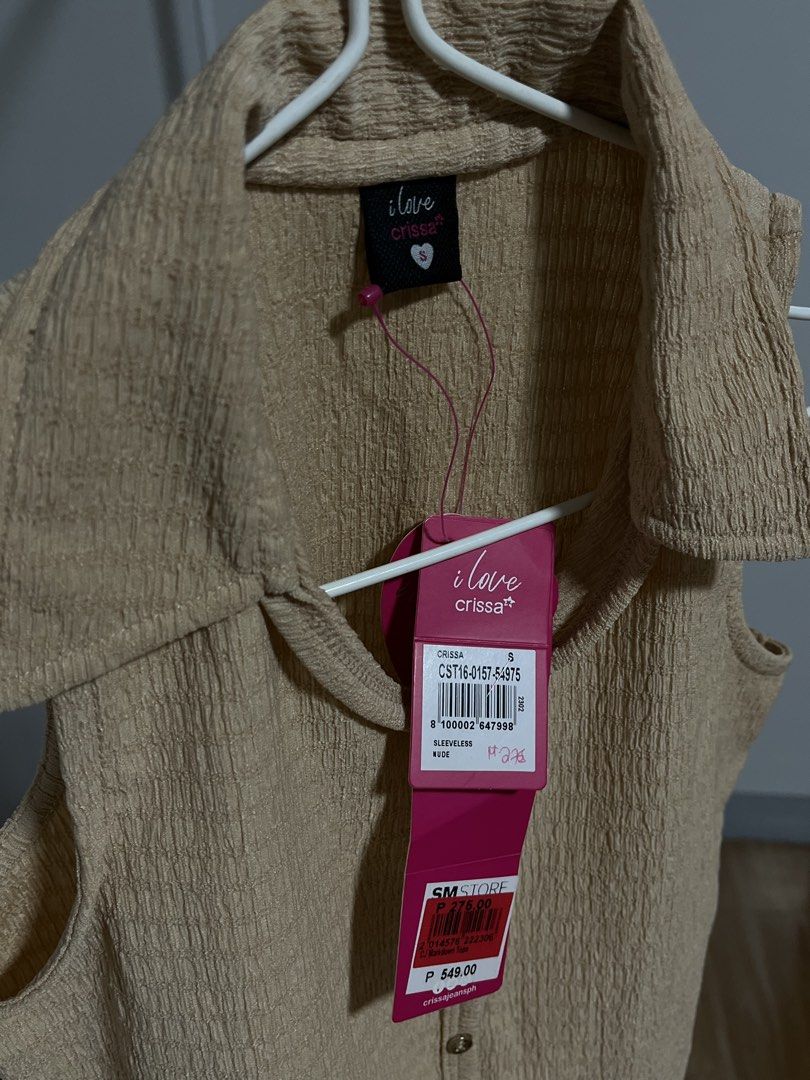 Crissa Sleeveless Collared Top - Beige (Small) (Category: Sleeveless) located in Legazpi City. Submitted by cluttersofcy (Listing ID 1459116027, Image 2). Description: - Brand: I Love Crissa - Size: S - Color: Beige - Style: Sleeveless top - Features: Textured fabric, collared neckline, button-up front - Size: S - Condition: Brand new with original tags attached - Origin: Purchased from SM Store.