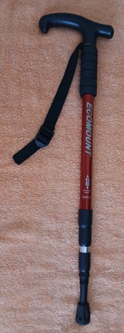 Ecomount Red Anti-Shock Trekking Pole (Category: Hiking & Camping) located in Makati City. Submitted by chamarket.2022 (Listing ID 1459214242, Image 1). Description: Adjustable trekking pole from Ecomount. Red aluminum shaft with anti-shock system. Measures up to 110cm. T-handle with wrist strap. Rubber tip and cap included. Lightweight and great for hiking/walking. Note: the ring holding the strap has rust. However, it doesn't affect the functio