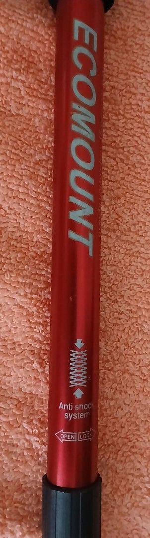 Ecomount Red Anti-Shock Trekking Pole (Category: Hiking & Camping) located in Makati City. Submitted by chamarket.2022 (Listing ID 1459214242, Image 3). Description: Adjustable trekking pole from Ecomount. Red aluminum shaft with anti-shock system. Measures up to 110cm. T-handle with wrist strap. Rubber tip and cap included. Lightweight and great for hiking/walking. Note: the ring holding the strap has rust. However, it doesn't affect the functio