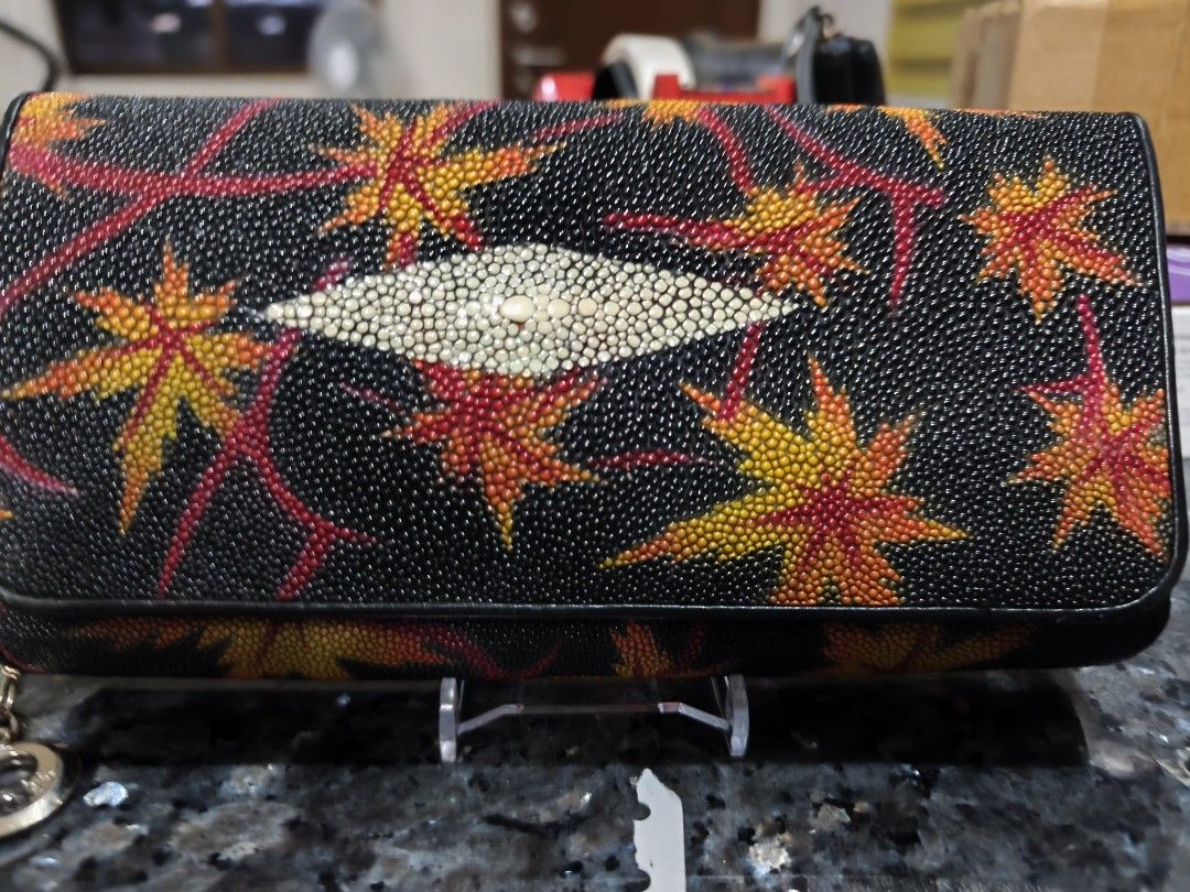 FINDIG Stingray Leather Wallet with Maple Leaf Design (Category: Wallets & Card holders) located in Quezon City. Submitted by wrsebastian29 (Listing ID 1459213289, Image 1). Description: - Stylish black wallet - Unique stingray leather centerpiece - Vibrant maple leaf and vine pattern - Multiple card slots and compartments - Quality leather goods by FINDIG - Nicely designed and neatly sewn - Perfect for everyday use.