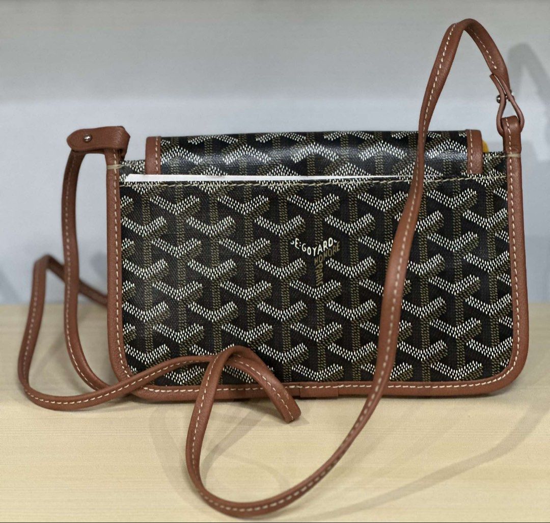 Goyard Crossbody Bag Brown Monogram (Category: Luxury Bags & Wallets) located in Midsayap. Submitted by bagski (Listing ID 1459237537, Image 2). Description: - Goyard crossbody bag in classic brown and tan monogram. - Features durable leather trim and adjustable strap. - Eye-catching yellow accent on the flap adds a unique touch. - Secure snap closure for your peace of mind. - Compact and stylish, ideal for carrying your daily essentials. -riri z