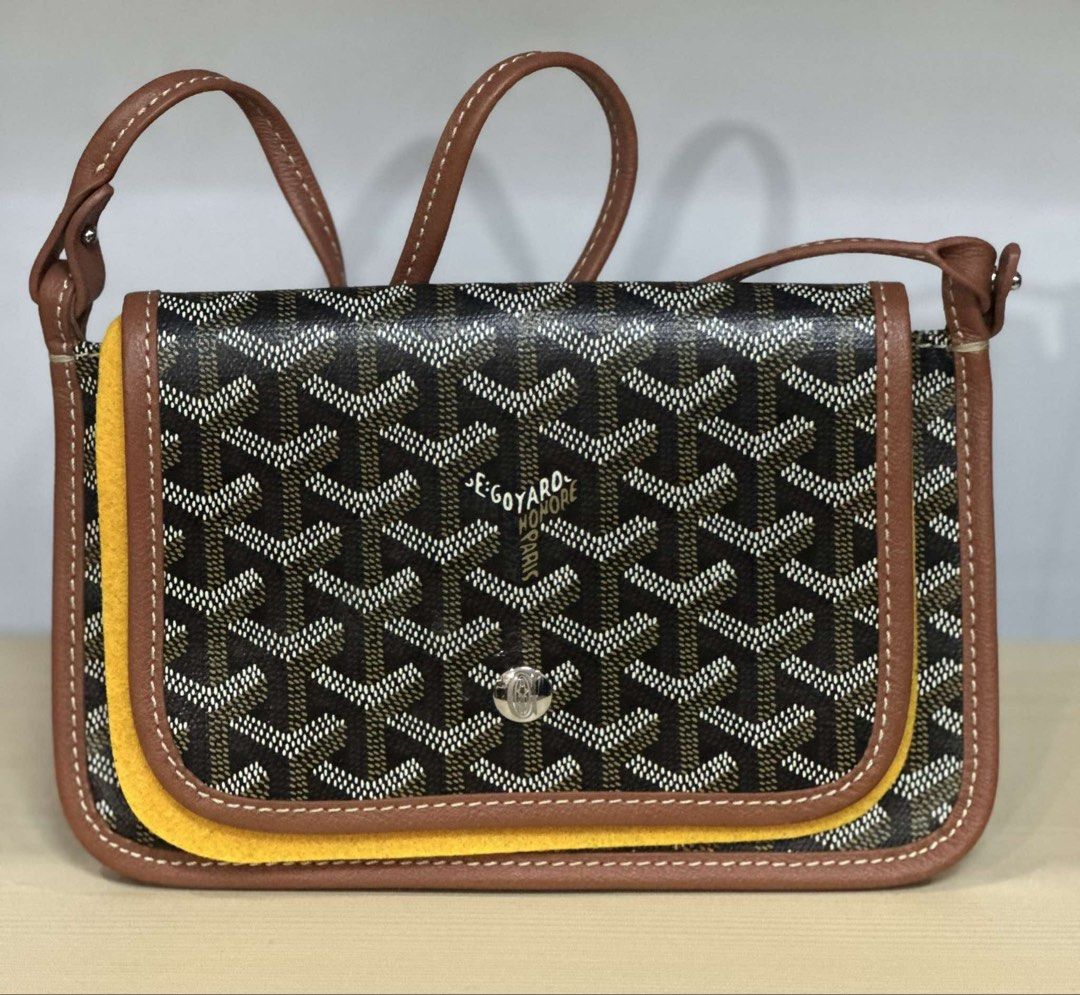Goyard Crossbody Bag Brown Monogram (Category: Luxury Bags & Wallets) located in Midsayap. Submitted by bagski (Listing ID 1459237537, Image 1). Description: - Goyard crossbody bag in classic brown and tan monogram. - Features durable leather trim and adjustable strap. - Eye-catching yellow accent on the flap adds a unique touch. - Secure snap closure for your peace of mind. - Compact and stylish, ideal for carrying your daily essentials. -riri z
