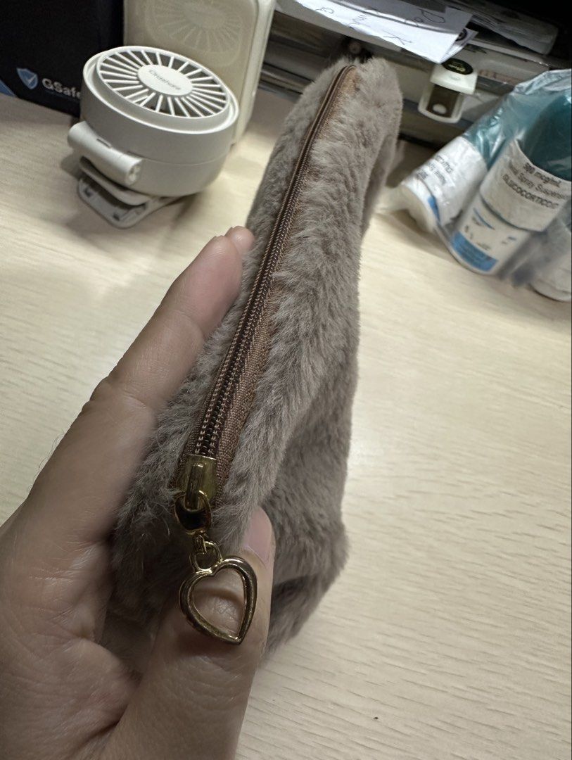 Gray Fur pouch (Category: Purses & Pouches) located in Manila. Submitted by shopkriscloset (Listing ID 1459252425, Image 3). Description: ‼️PLEASE READ BEFORE PLACING AN OFFER: 🩵Please be patient and respectful. 🤗 If I don’t get to reply immediately, I might be working. 🧡Please REFRAIN from making an offer if you do not intend to complete the purchase‼️ 🧡Kindly read the description for more details on shipping and the product itself to preven