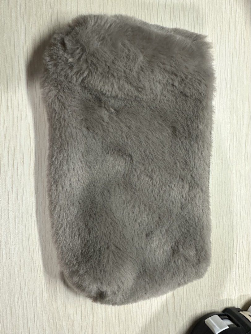 Gray Fur pouch (Category: Purses & Pouches) located in Manila. Submitted by shopkriscloset (Listing ID 1459252425, Image 1). Description: ‼️PLEASE READ BEFORE PLACING AN OFFER: 🩵Please be patient and respectful. 🤗 If I don’t get to reply immediately, I might be working. 🧡Please REFRAIN from making an offer if you do not intend to complete the purchase‼️ 🧡Kindly read the description for more details on shipping and the product itself to preven