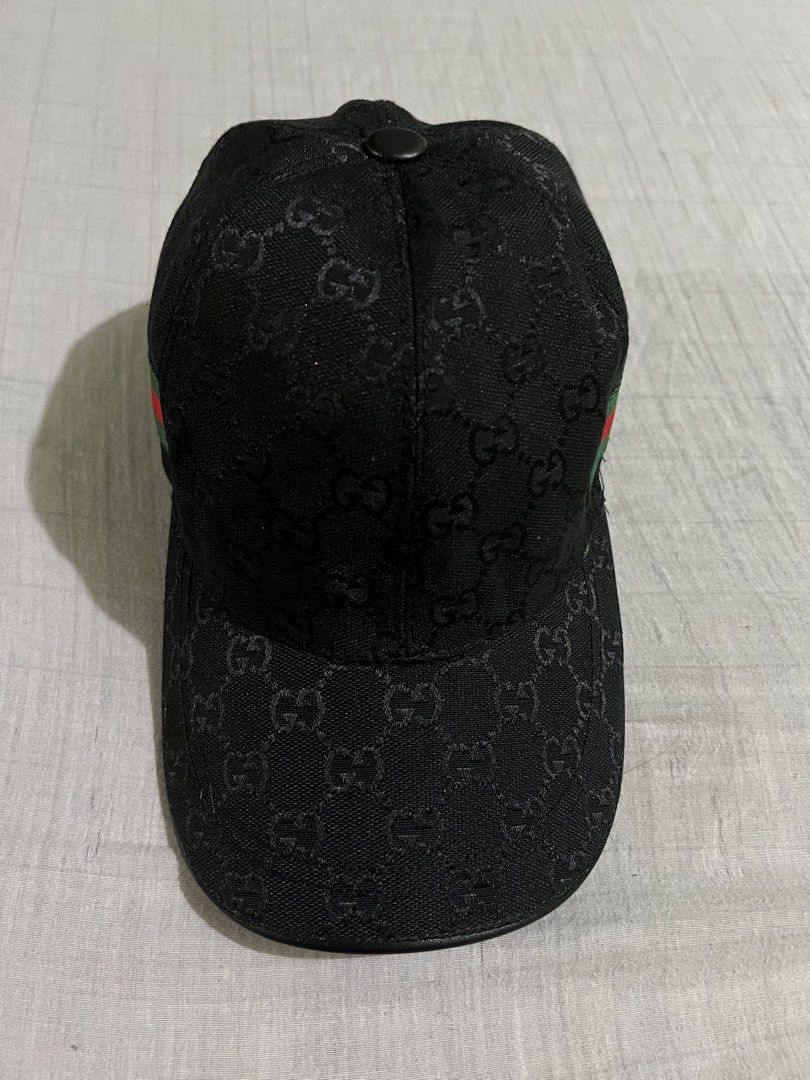 Gucci GG Monogram Baseball Cap (Category: Luxury Accessories) located in Dagupan City. Submitted by casadebayongph (Listing ID 1459215299, Image 2). Description: - Classic black Gucci cap - Features iconic GG monogram pattern - Signature green and red stripe detail - Adjustable leather strap at the back with Gucci logo - Versatile accessory for any outfit.