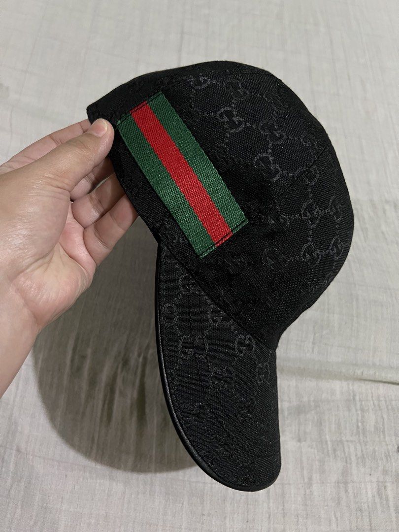 Gucci GG Monogram Baseball Cap (Category: Luxury Accessories) located in Dagupan City. Submitted by casadebayongph (Listing ID 1459215299, Image 3). Description: - Classic black Gucci cap - Features iconic GG monogram pattern - Signature green and red stripe detail - Adjustable leather strap at the back with Gucci logo - Versatile accessory for any outfit.