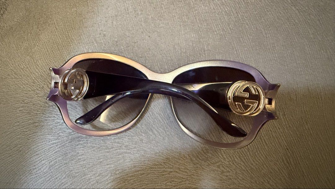 Gucci Sunglasses (Category: Sunglasses & Eyewear) located in Makati City. Submitted by genuinelygoods (Listing ID 1459119407, Image 2). Description: - Authentic Gucci sunglasses - Oversized frame with purple tint - Iconic GG logo on the sides - Gradient lenses - Perfect for sunny days - Comes with original case - Purple.