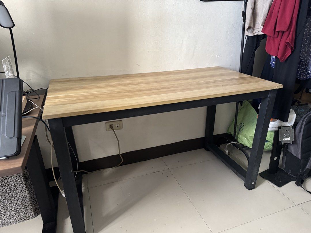 Home Office Desk Walnut Desktop Black Stand (Category: Tables & Sets) located in Manila. Submitted by jonxdc (Listing ID 1459140199, Image 2). Description: READ Used Home Office Desk with Walnut Desktop and Black Stand for Work from home setup Size: 120x60x70 cm RFS: Decluttering/Not using Minor issues: - Slight chippings in the sides of the table - Slight wobbling when shaken excessively > Price is negotiable > Accepting Gcash/Bank Transfer as P