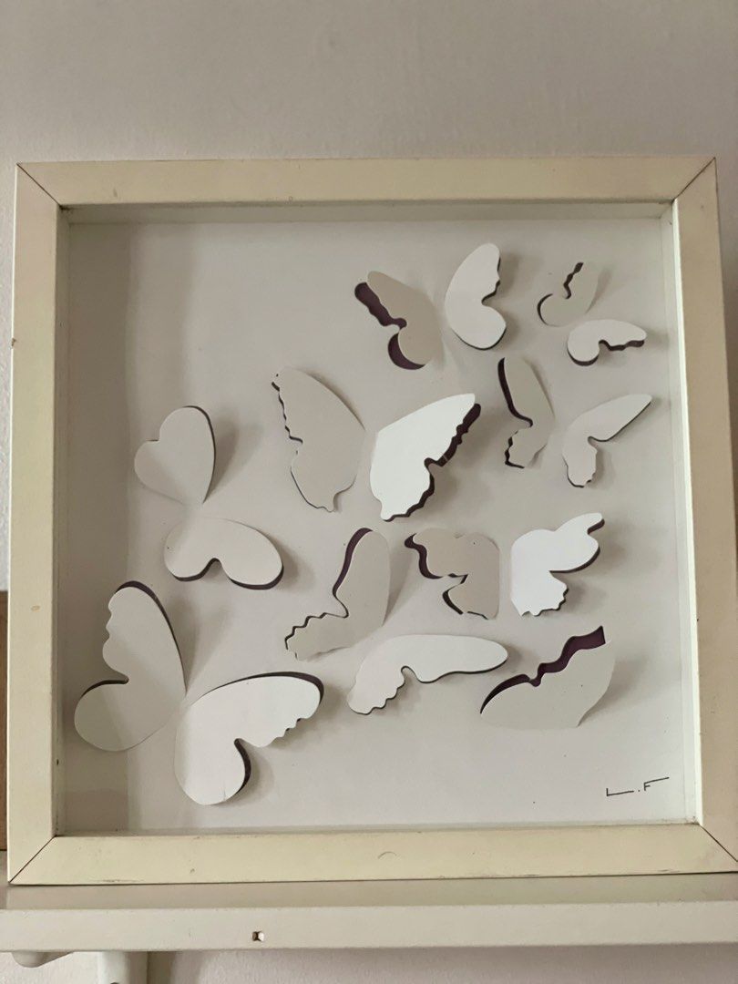 IKEA 3D Butterfly Shadow Wall Decor (Category: Wall Decor) located in Manila. Submitted by declutteredbyalex (Listing ID 1459112674, Image 2). Description: Size: 30 cm x 30 cm (11 3/4” x 11 3/4”) - Comes with a pre-installed saw-tooth hanger on the back for easy wall hanging or shelf display. - Clean pre-loved condition with minor, - light marks on the outer white frame edges but not noticeable RFS: Decluttering.