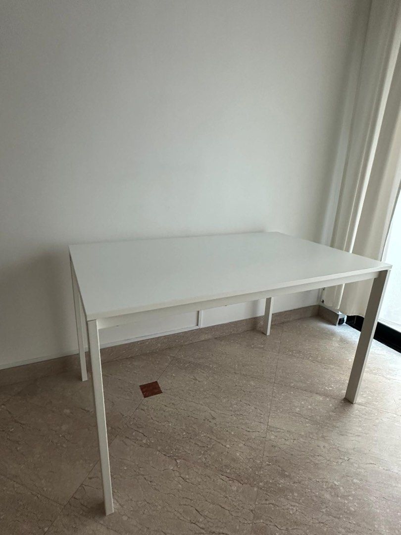 IKEA White Rectangular Dining Table Study Table (Category: Tables & Sets) located in Singapore. Submitted by chifanle (Listing ID 1459117895, Image 2). Description: - Versatile white table - Perfect for dining or as a work desk - Comfortably seats up to 4 people - Easy-to-clean surface - Sturdy and stable legs - Fits well in most room sizes - Selling due to relocation.