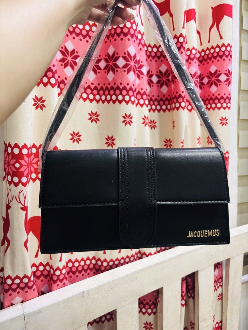 Jacquemus Black Leather Shoulder Bag (Category: Luxury Bags & Wallets) located in Quezon City. Submitted by itsmeriaa (Listing ID 1459248017, Image 1). Description: black leather shoulder bag with gold Jacquemus logo. Features a buckle flap closure and a clear plastic strap. Perfect for day or night..