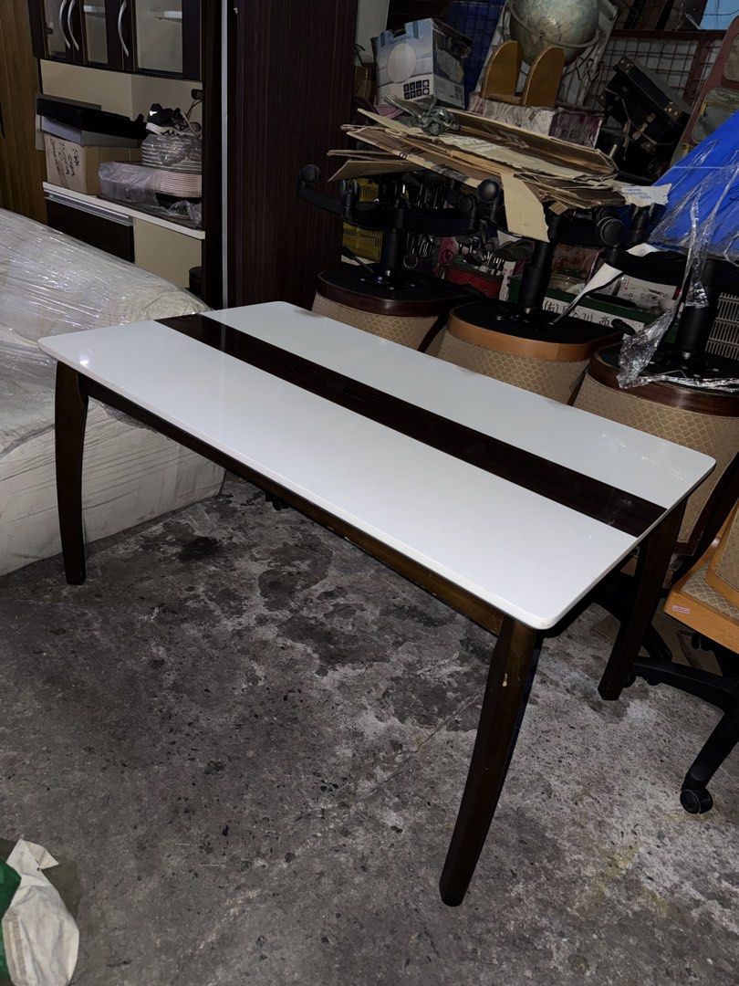 Japan Table Solid Wood H28 L53 W32 inches (Category: Tables & Sets) located in Quezon City. Submitted by mikesiawingco (Listing ID 1459204557, Image 3). Description: - Solid wood table, imported from Japan - Elegant white top with dark wood accent - Dimensions: 28 inches high, 53 inches long, 32 inches wide - Versatile use: ideal for dining or as a work desk - Features sturdy legs for stability.