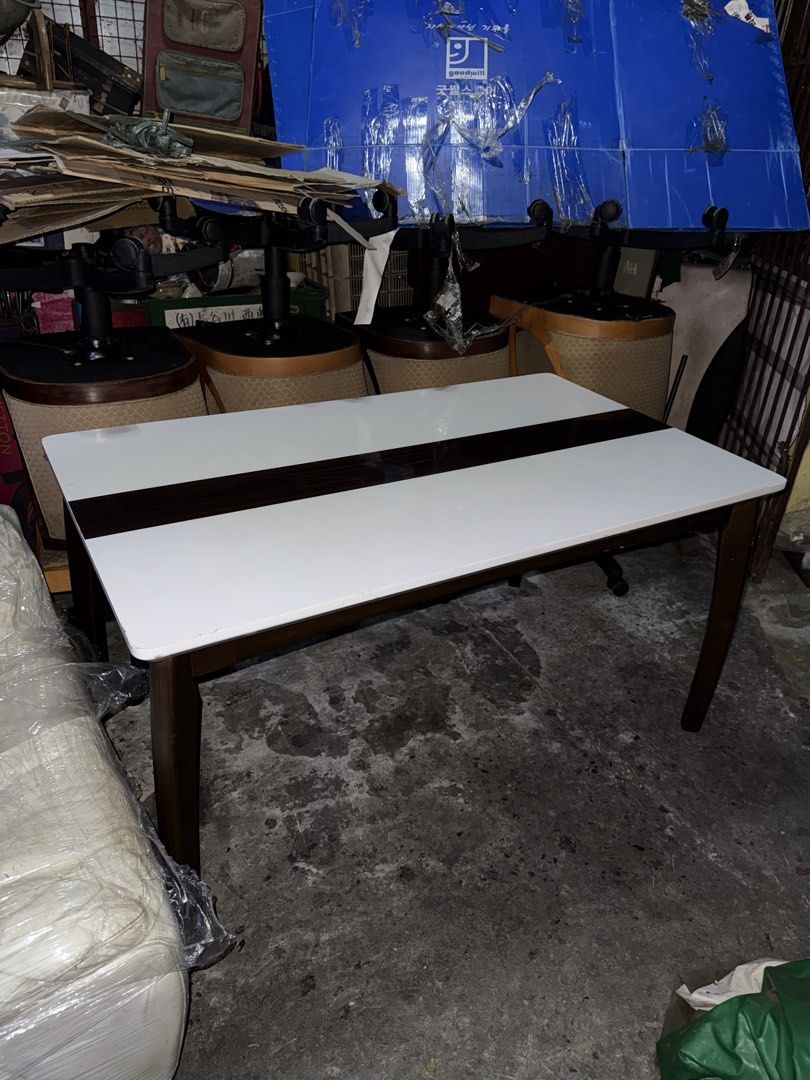 Japan Table Solid Wood H28 L53 W32 inches (Category: Tables & Sets) located in Quezon City. Submitted by mikesiawingco (Listing ID 1459204557, Image 2). Description: - Solid wood table, imported from Japan - Elegant white top with dark wood accent - Dimensions: 28 inches high, 53 inches long, 32 inches wide - Versatile use: ideal for dining or as a work desk - Features sturdy legs for stability.