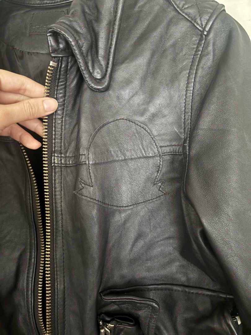 Japanese Black Leather Bomber Jacket (Category: Coats, Jackets and Outerwear) located in Cainta. Submitted by doverparfum (Listing ID 1459168290, Image 3). Description: - Cool black leather bomber jacket - Brand: min@RNA - Zip-up front - Features pockets - Ribbed cuffs and hem - Perfect for layering - Pairs well with jeans or dressier outfits - A timeless wardrobe essential.