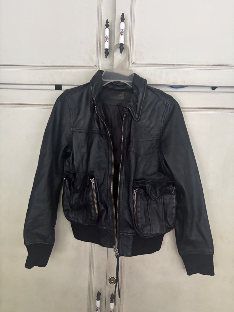 Japanese Black Leather Bomber Jacket (Category: Coats, Jackets and Outerwear) located in Cainta. Submitted by doverparfum (Listing ID 1459168290, Image 1). Description: - Cool black leather bomber jacket - Brand: min@RNA - Zip-up front - Features pockets - Ribbed cuffs and hem - Perfect for layering - Pairs well with jeans or dressier outfits - A timeless wardrobe essential.