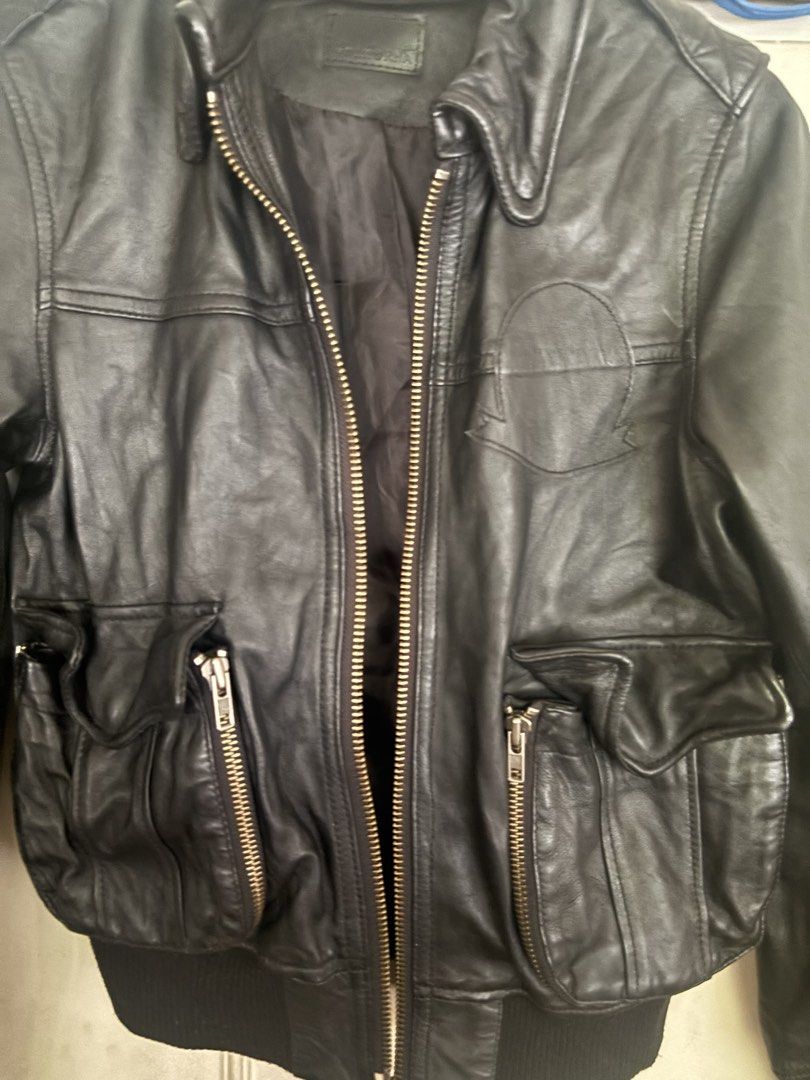 Japanese Black Leather Bomber Jacket (Category: Coats, Jackets and Outerwear) located in Cainta. Submitted by doverparfum (Listing ID 1459168290, Image 2). Description: - Cool black leather bomber jacket - Brand: min@RNA - Zip-up front - Features pockets - Ribbed cuffs and hem - Perfect for layering - Pairs well with jeans or dressier outfits - A timeless wardrobe essential.