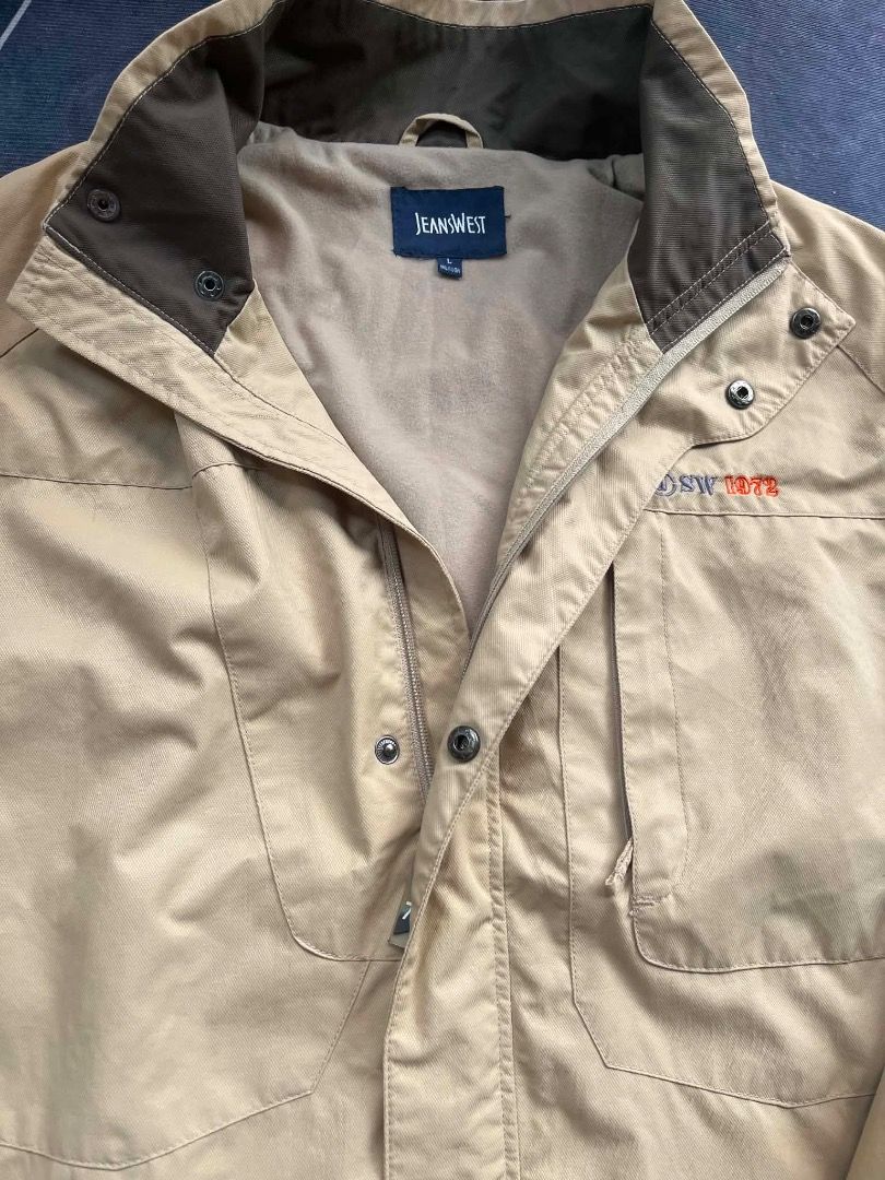 Jeanwest Khaki Jacket with Embroidered Logo (Category: Coats, Jackets and Outerwear) located in Caloocan City. Submitted by villathrift (Listing ID 1459103171, Image 3). Description: - Brand: Jeanwest - Color: Khaki - Closure: Zip and button - Pockets: Two chest pockets, two side pockets - Features: Embroidered logo on chest - Ideal for: Outdoor activities, casual wear - Qualities: Comfortable, durable.