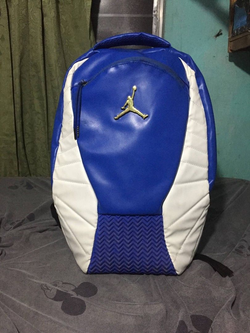Jordan Backpack Blue and White (Category: Backpacks) located in Taguig. Submitted by mark_antaran (Listing ID 1459097397, Image 1). Description: - Stylish blue Jordan backpack with white accents - Iconic Jumpman logo on the front - Spacious main compartment with internal organization pockets - Comfortable padded shoulder straps - Perfect for school, gym, or everyday adventures - Shows minor signs of wear, but plenty of life left!.