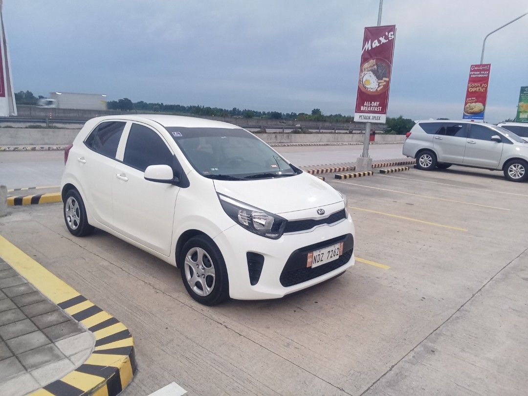 Kia Picanto 1.0 lx a/t Auto (Category: Used Cars) located in Taguig. Submitted by hoots_ (Listing ID 1459147822, Image 2). Description: pristine like new engine 90% intetior 95% body 90% ussd but not abused alaga ang auto low mileage first owner complete or n cr insurancs with acts of God never flooded automatic trans gagamitin mo nalang no issues until 380 k lang po mid variant ito.