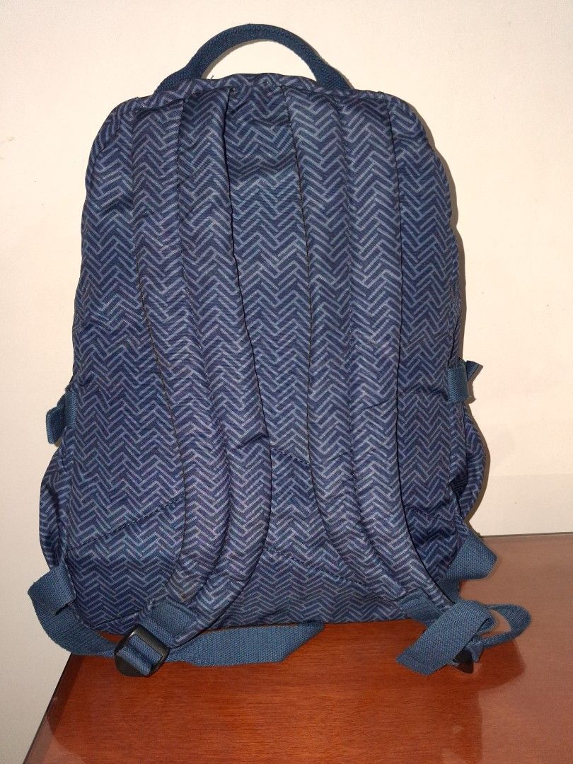 Tegaote Blue Chevron Pattern Backpack with Monkey Charm (Category: Backpacks) located in Angeles City. Submitted by anneps (Listing ID 1459196358, Image 3). Description: - Blue backpack - Stylish chevron pattern - Front zip pocket for easy access - Adjustable straps for comfort - Includes signature Kipling monkey charm - Spacious main compartment - Ideal for school, work, or everyday adventures.