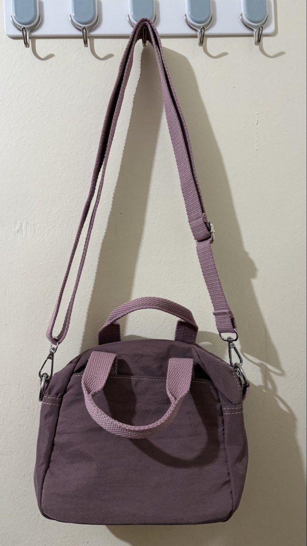 Kipling Inspired Crossbody Bag Lavender Nylon (Category: Cross-body Bags) located in Rizal. Submitted by lovegclothingph (Listing ID 1459215080, Image 3). Description: - Lavender nylon crossbody bag - Has top handles and a detachable shoulder strap - Front zip pocket with a smaller zip pocket inside - Main compartment also has a zip closure. - Small logo on the front - Great for everyday use - RFS: Decluttering.