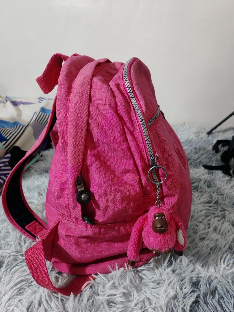 Kipling Pink Backpack with Monkey Charm (Category: Backpacks) located in Manila. Submitted by camellesal67218 (Listing ID 1459119466, Image 2). Description: - Adorable pink Kipling backpack - Includes signature monkey charm - Spacious main compartment with internal pockets - Convenient front zip pocket for quick access - Adjustable straps for a comfortable fit - Ideal for everyday use or travel adventures - Ample space for all your essentials.