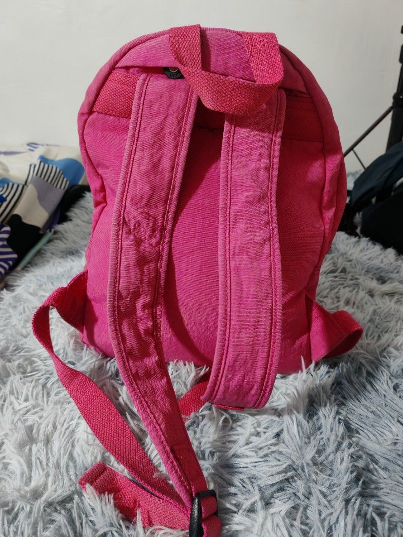 Kipling Pink Backpack with Monkey Charm (Category: Backpacks) located in Manila. Submitted by camellesal67218 (Listing ID 1459119466, Image 3). Description: - Adorable pink Kipling backpack - Includes signature monkey charm - Spacious main compartment with internal pockets - Convenient front zip pocket for quick access - Adjustable straps for a comfortable fit - Ideal for everyday use or travel adventures - Ample space for all your essentials.