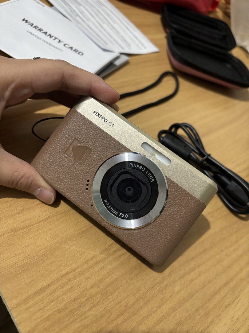 Kodak PIXPRO C1 Digital Camera (with SD card and case) (Category: Cameras) located in Manila. Submitted by jess_md (Listing ID 1459192510, Image 1). Description: - Kodak PIXPRO C1 Digital Camera - Flip-up screen perfect for selfies and vlogging - Includes original warranty card and charging cable - Elegant brown and gold finish - Ideal for casual photography Bought from MVP Camera in orange app last Feb 2026 RFS: upgraded to more technical camera