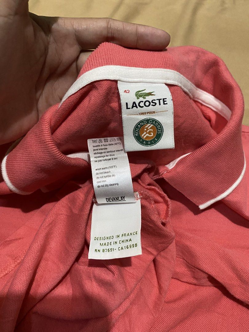 Lacoste Pink Polo Shirt (Category: Others Tops) located in Samal. Submitted by regbos26 (Listing ID 1459276680, Image 2). Description: L@cost€ Pink Polo Shirt by Rol@nd G@rros Paris Gwapa kaayo!😍 Like new,bagong bago No flaws! Embroid details Must have! Fave🥰 Naka engrave lahat ng buttons Size 42 on tag Complete tags.