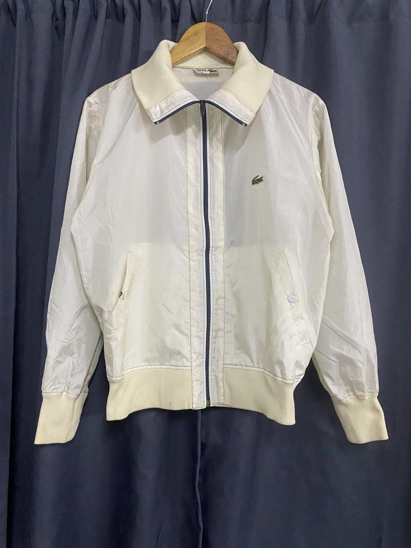 Lacoste White Zip-Up Jacket (Category: Luxury Apparel) located in Santa Maria. Submitted by saintarchive316 (Listing ID 1459192975, Image 1). Description: - Classic white Lacoste jacket - Features iconic crocodile logo on chest - Zip-up front with comfortable collar - Ribbed cuffs and hem for a snug fit - Versatile for layering or as light outerwear.
