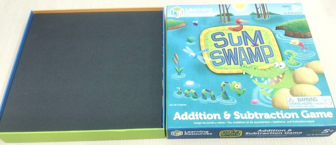 Learning Resources Sum Swamp Addition & Subtraction Game (Category: Board Games & Puzzles) located in Taguig. Submitted by Bloomscorner1 (Listing ID 1459190659, Image 3). Description: - a high quality Sum Swamp Addition & Subtraction Game by Learning Resources - Perfect for 2-4 players, ages 5 and up - Navigate a swampy maze by rolling dice. Be the first to wind your way to the finish line! - Practice addition and subtraction skills to reach the 