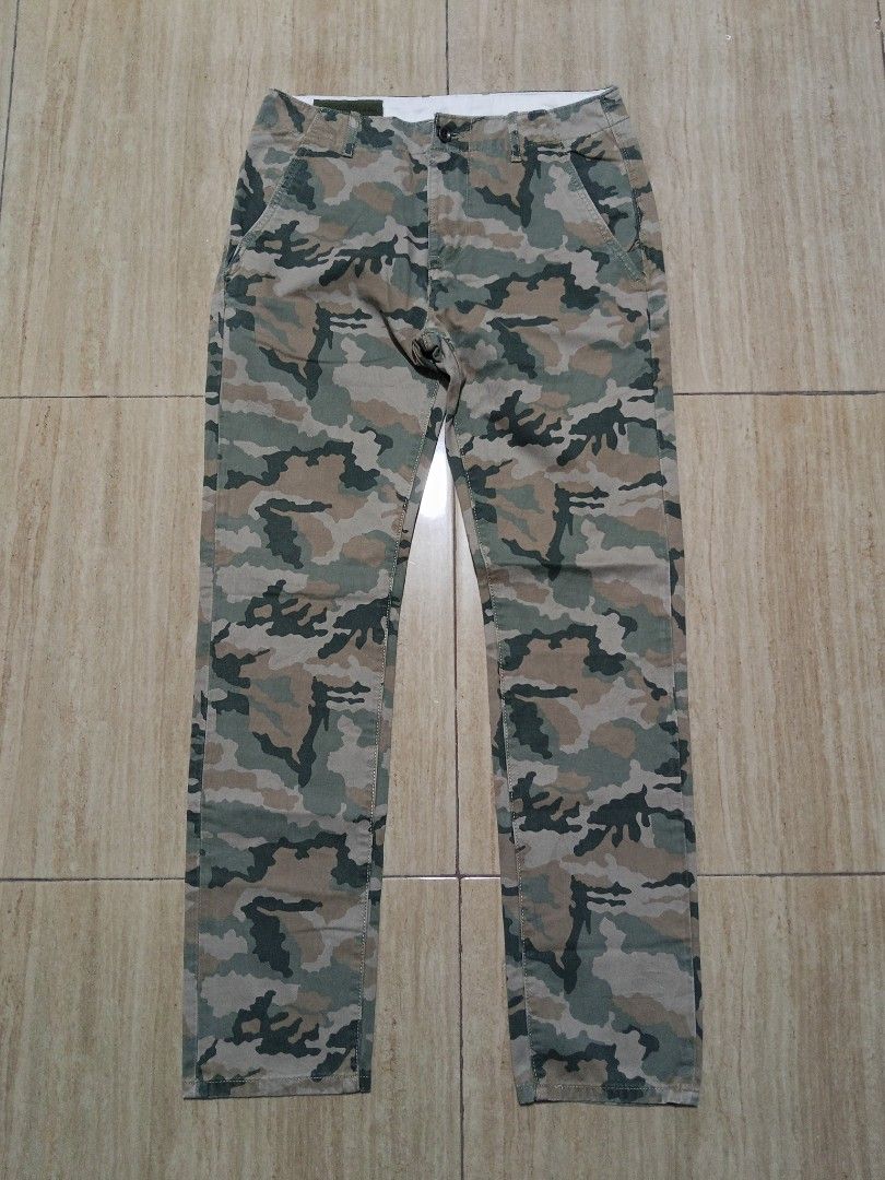 Levi's Camouflage Cargo Pants (Category: Jeans) located in Glan. Submitted by cpaharodde48008 (Listing ID 1459254119, Image 3). Description: - Classic Levi's camouflage cargo pants - Features green, brown, and tan camo print - Multiple functional pockets for storage - Secure button and zip closure - Comfortable straight leg fit - Perfect for casual outings or outdoor adventures - In good, pre-loved condition and ready for a new home.