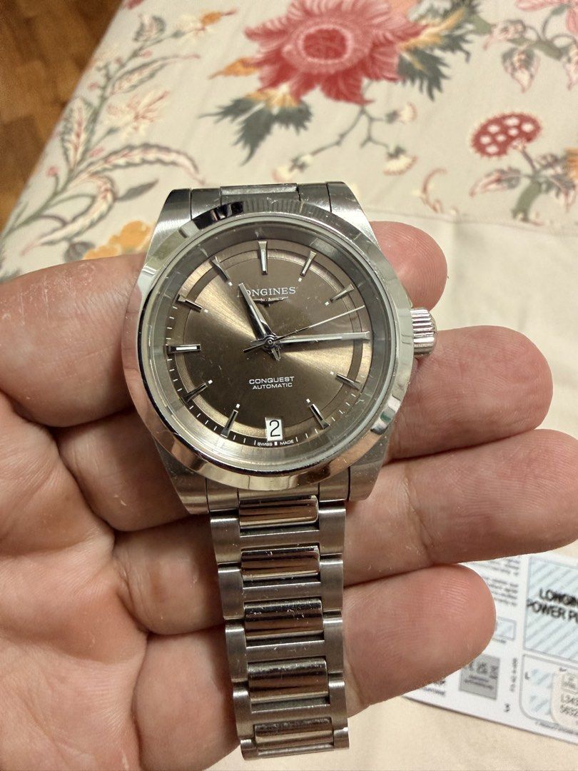 Longines Conquest Automatic Stainless Steel Watch (Category: Luxury Watches) located in Makati City. Submitted by jmvm88 (Listing ID 1459113624, Image 2). Description: - Longines Conquest Automatic Watch, 34MM - Stainless Steel Case and Bracelet - Sunray Dial with Date Window - Minor Scratches on Bracelet and Clasp (Selling As Is) - Includes Warranty Card (Dated November 16, 2024) - With Receipt.