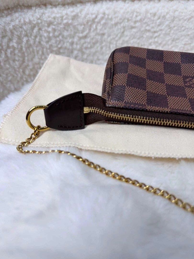 Louis Vuitton Damier Ebene Pochette Accessoires (Category: Luxury Bags & Wallets) located in Pasay City. Submitted by watch.authentic_ph (Listing ID 1459092345, Image 3). Description: - Authentic Louis Vuitton Pochette Accessoires - Damier Ebene canvas - Gold-tone chain strap - Zipper closure - Includes dust bag - Ideal for carrying essentials #highlight #fyp.