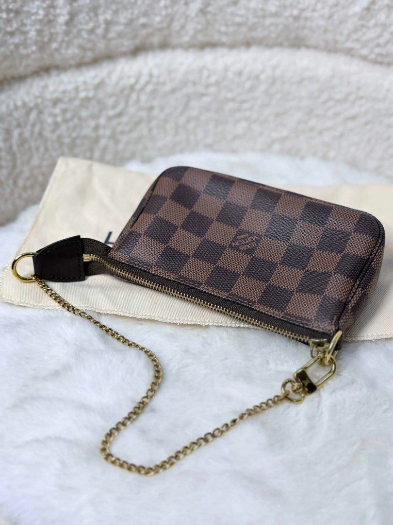 Louis Vuitton Damier Ebene Pochette Accessoires (Category: Luxury Bags & Wallets) located in Pasay City. Submitted by watch.authentic_ph (Listing ID 1459092345, Image 2). Description: - Authentic Louis Vuitton Pochette Accessoires - Damier Ebene canvas - Gold-tone chain strap - Zipper closure - Includes dust bag - Ideal for carrying essentials #highlight #fyp.