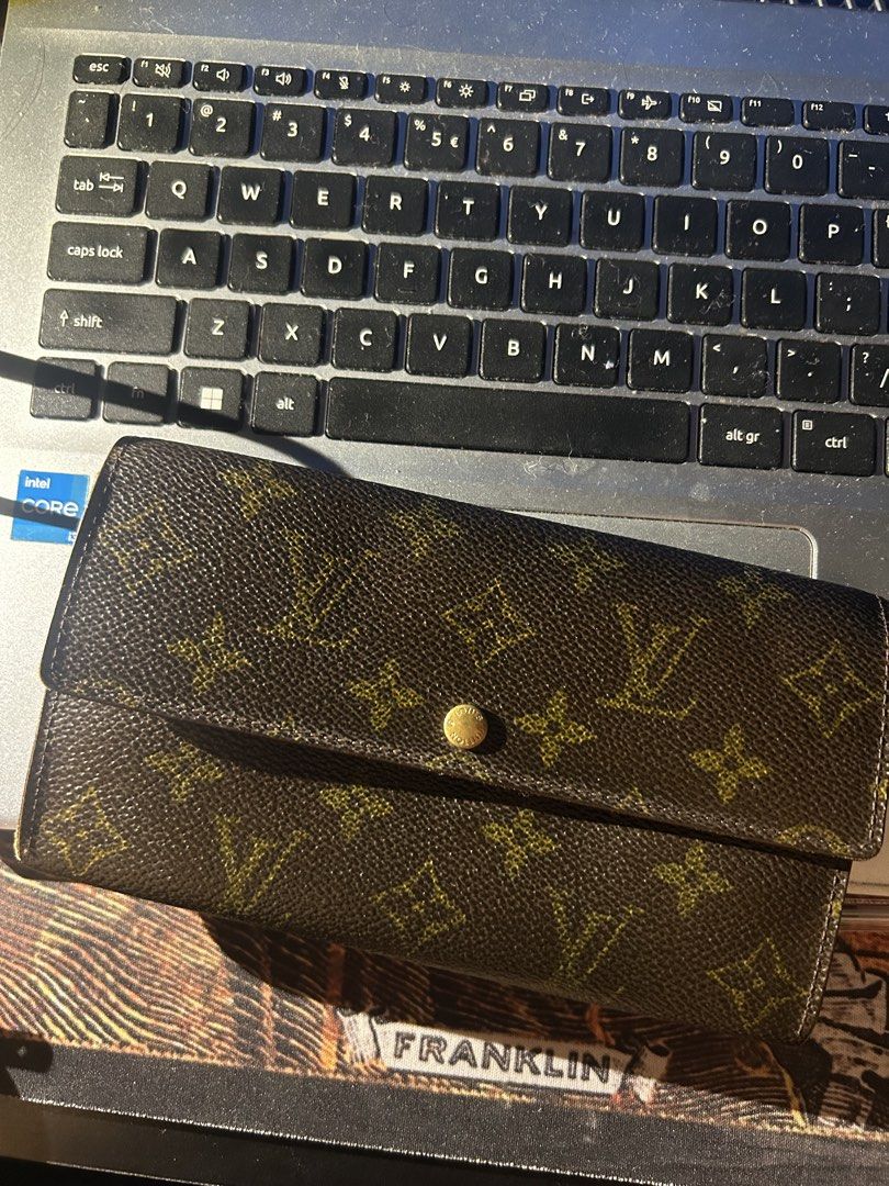 Louis Vuitton Monogram Canvas Long Wallet (Category: Luxury Bags & Wallets) located in Manila. Submitted by geraldee (Listing ID 1459118221, Image 1). Description: - Classic Louis Vuitton long wallet - Monogram canvas exterior - Brown interior with multiple card slots and zip pocket - Secure snap button closure - Timeless essential accessory.