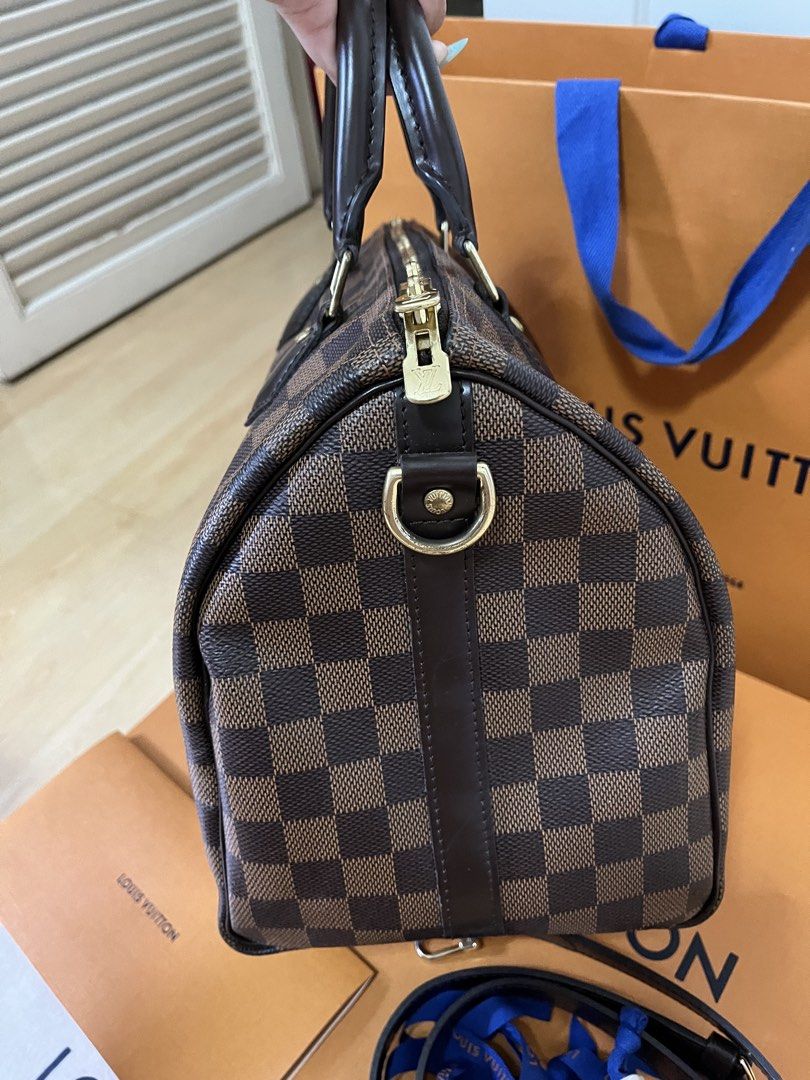 Louis Vuitton Speedy 30 Damier Ebene (Category: Luxury Bags & Wallets) located in Pasig City. Submitted by declutterskt (Listing ID 1459136811, Image 3). Description: - Authentic, with gift receipt - Gold hardware - Very spacious and great for daily use or travel - Barely used, still in good shape Inclusions: Comes with original dust bag, box, paper bag, lock with keys, ribbon Condition: Very Good (8.5/10) - Distinct smell - Moderate scratches on