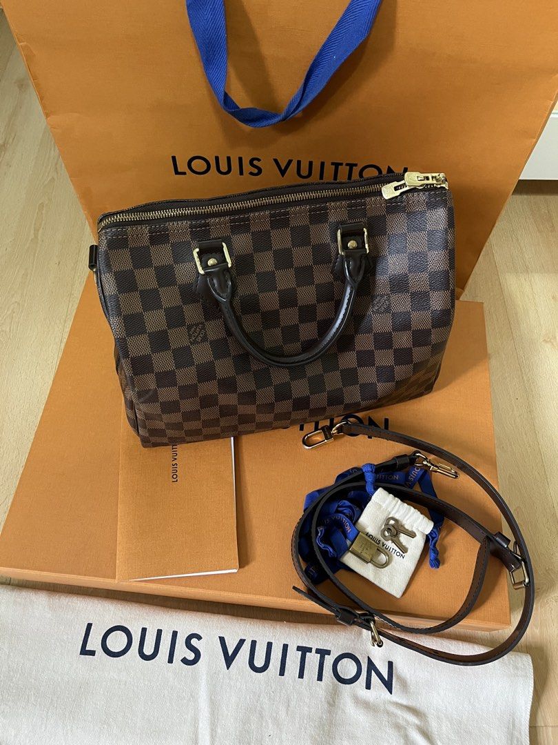 Louis Vuitton Speedy 30 Damier Ebene (Category: Luxury Bags & Wallets) located in Pasig City. Submitted by declutterskt (Listing ID 1459136811, Image 2). Description: - Authentic, with gift receipt - Gold hardware - Very spacious and great for daily use or travel - Barely used, still in good shape Inclusions: Comes with original dust bag, box, paper bag, lock with keys, ribbon Condition: Very Good (8.5/10) - Distinct smell - Moderate scratches on