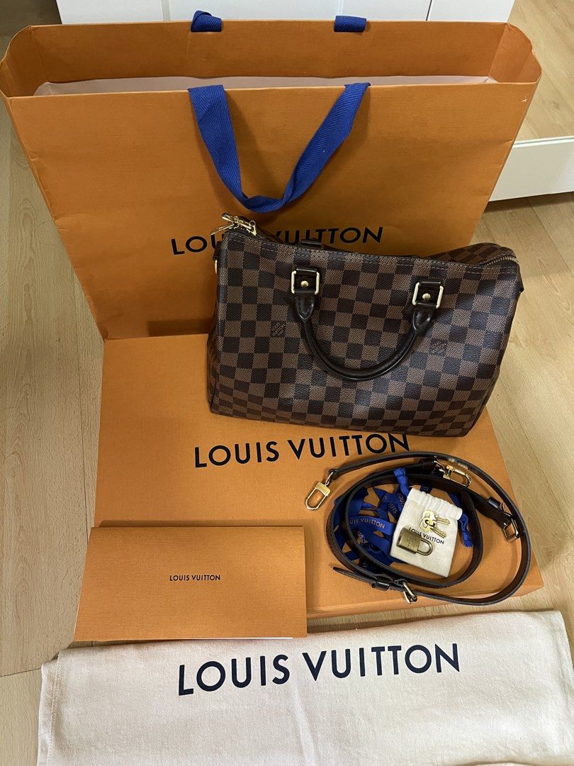 Louis Vuitton Speedy 30 Damier Ebene (Category: Luxury Bags & Wallets) located in Pasig City. Submitted by declutterskt (Listing ID 1459136811, Image 1). Description: - Authentic, with gift receipt - Gold hardware - Very spacious and great for daily use or travel - Barely used, still in good shape Inclusions: Comes with original dust bag, box, paper bag, lock with keys, ribbon Condition: Very Good (8.5/10) - Distinct smell - Moderate scratches on