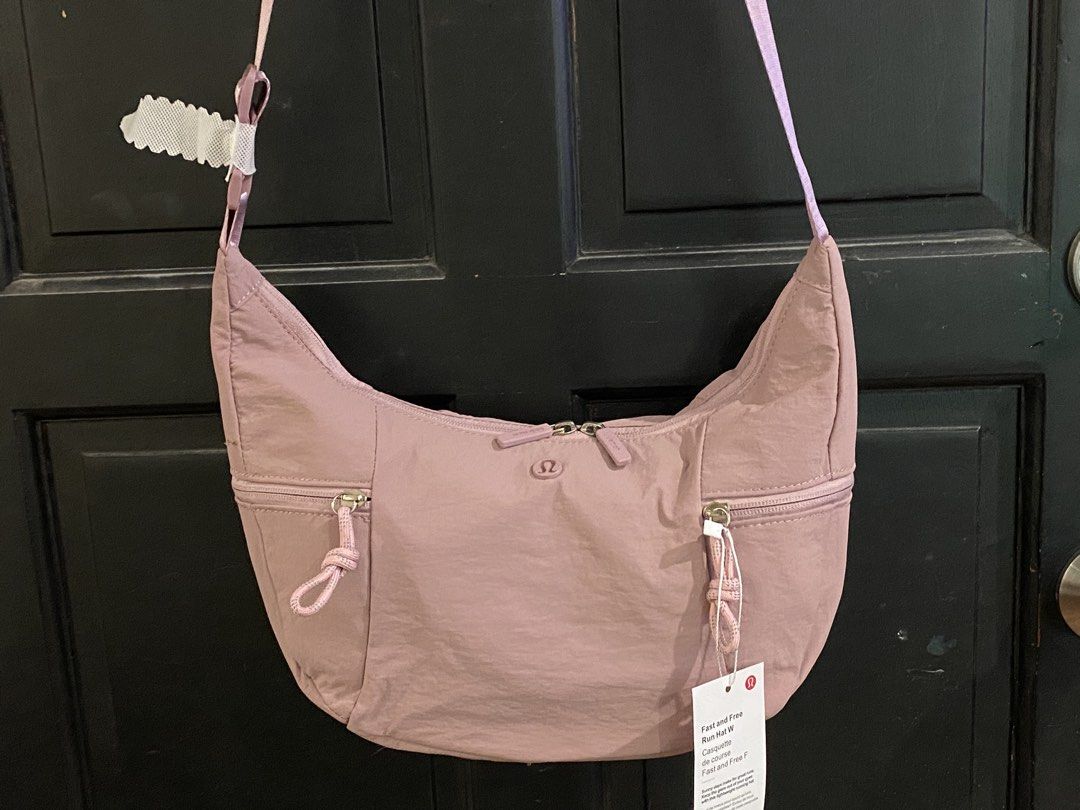 Lululemon Bag - Lilac (Category: Cross-body Bags) located in Muntinlupa City. Submitted by mj.finds (Listing ID 1459205720, Image 1). Description: - Lululemon Bag - Size: Large - Color: Lilac - Material: Recycled Polyester - Features: Zippered pockets, adjustable strap - Origin: Designed in Vancouver, Made in Indonesia - Ideal for: Everyday use.