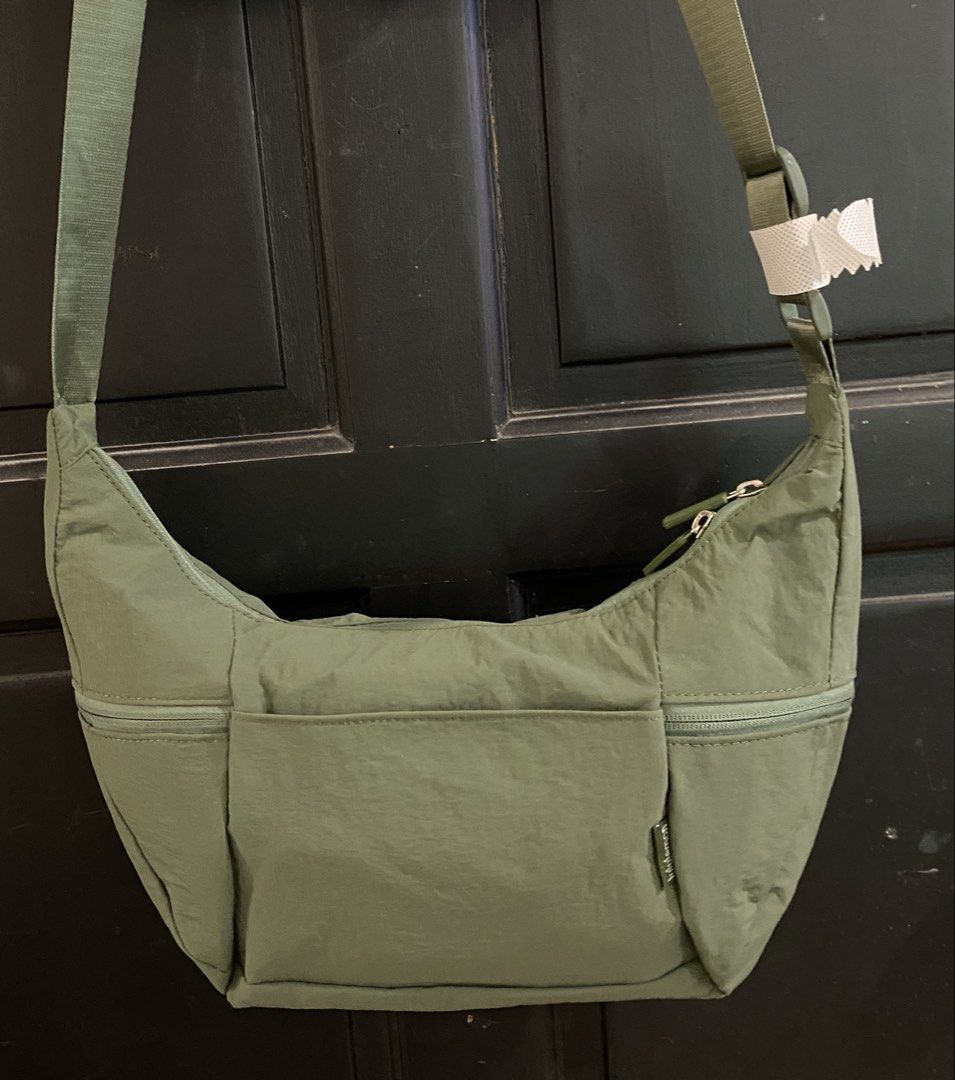 Lululemon Bag - Olive Green (Category: Cross-body Bags) located in Muntinlupa City. Submitted by mj.finds (Listing ID 1459208394, Image 2). Description: - Olive Green Lululemon Everywhere Bag - Made with durable, water-repellent fabric - Features a secure zippered main compartment and front pocket - Adjustable strap for comfortable, customized wear - Ideal for everyday errands, travel, and workouts - Comes with original Lululemon tags attached.
