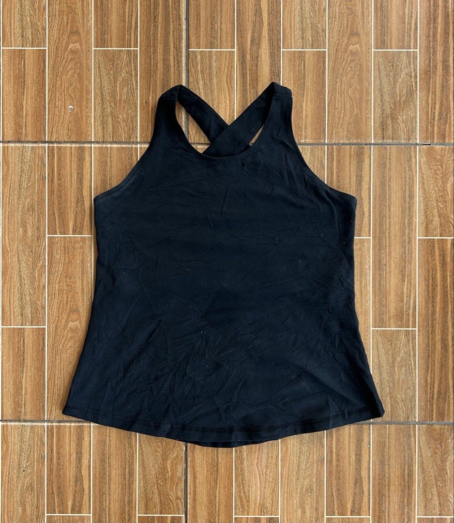 Lululemon Black Criss-Cross Back Tank Top (Category: Activewear) located in Cagayan de Oro. Submitted by aljay02 (Listing ID 1459210849, Image 1). Description: - Lululemon black tank top - Features stylish criss-cross straps at the back - Ideal for workouts or casual wear - Made from soft and comfortable material - Measurements: Approximately 13 inches across the chest and 20 inches in length.