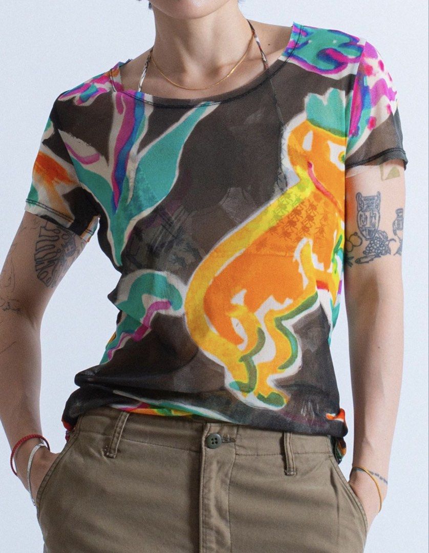 Mainline Issey Miyake Sheer Mesh Top (Category: Shirts) located in Cavite. Submitted by sc_rcity (Listing ID 1459262058, Image 3). Description: Tagged Size : 2 Women’s Authentic Like New No Flaw Made in Japan One of a kind piece ! Something you wont see everyday. You usually encounter a pleated designs from Issey Miyake but this one is different. Iykyk The shirt showcases a vivid, watercolor-style abstract pattern. It features organic shapes in s