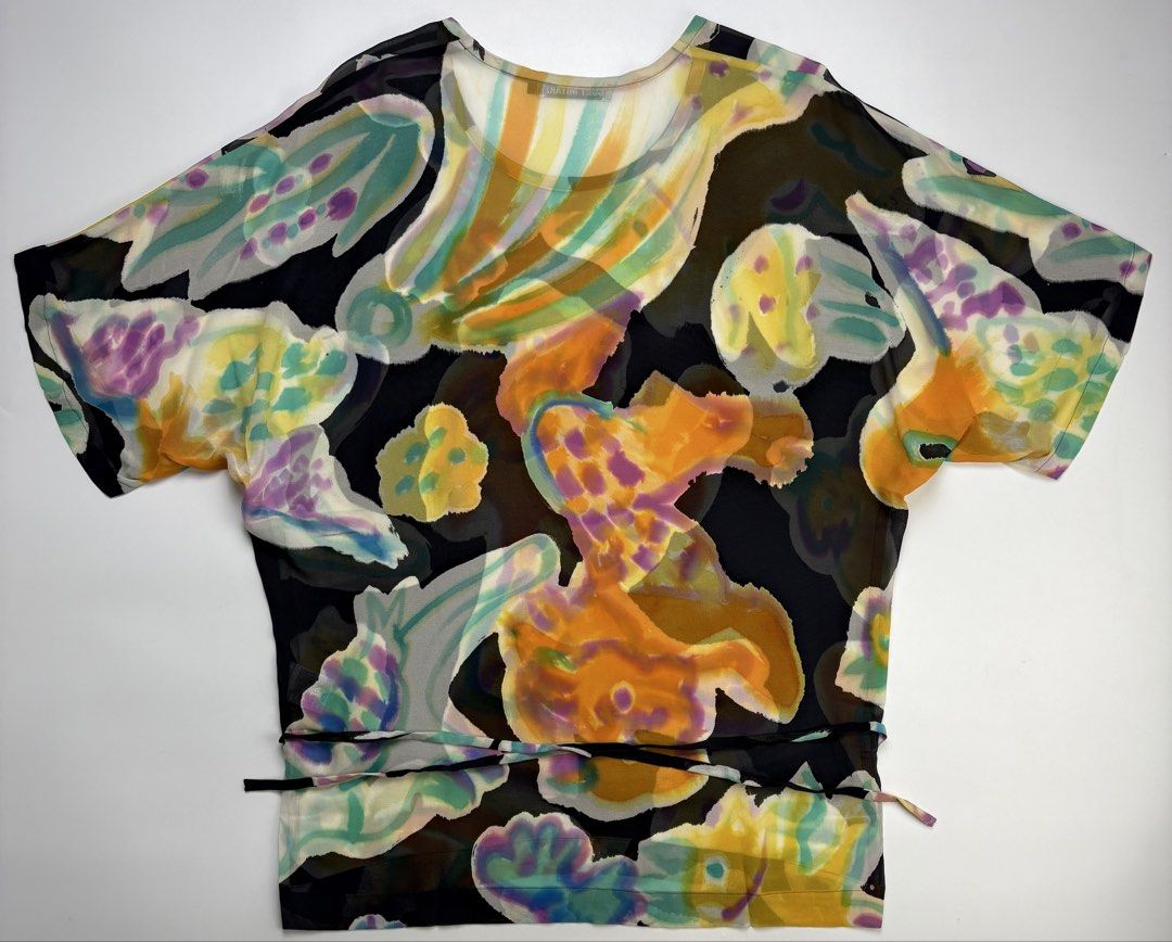 Mainline Issey Miyake Sheer Mesh Top (Category: Shirts) located in Cavite. Submitted by sc_rcity (Listing ID 1459262058, Image 2). Description: Tagged Size : 2 Women’s Authentic Like New No Flaw Made in Japan One of a kind piece ! Something you wont see everyday. You usually encounter a pleated designs from Issey Miyake but this one is different. Iykyk The shirt showcases a vivid, watercolor-style abstract pattern. It features organic shapes in s