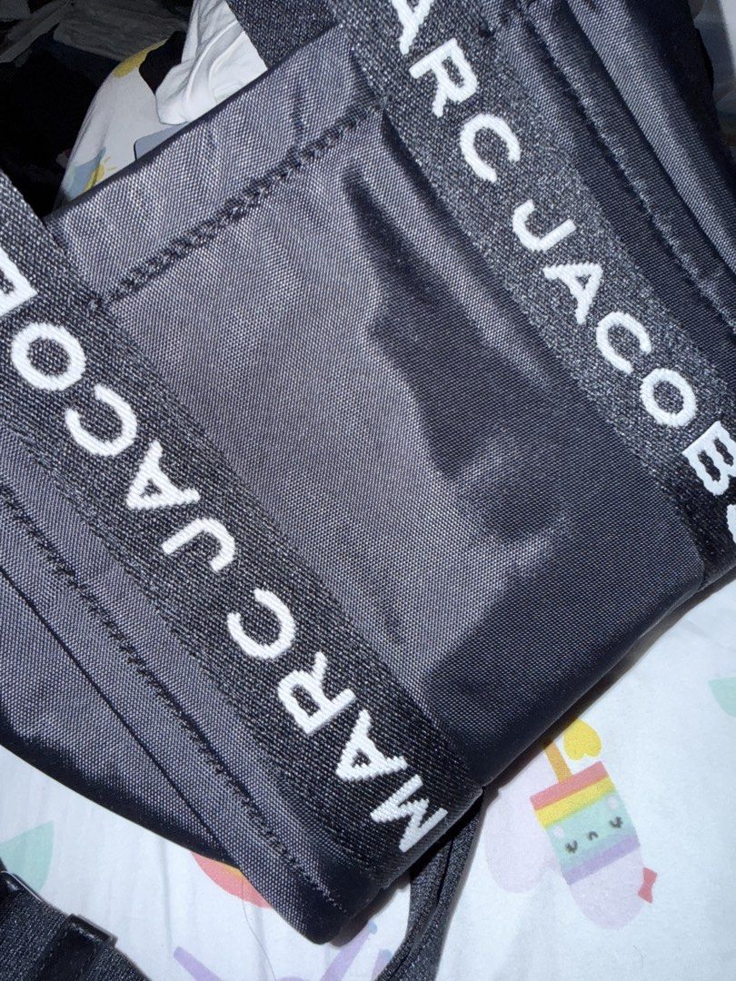 Marc Jacobs The Tote Bag Black Nylon (Category: Luxury Bags & Wallets) located in Cebu City. Submitted by adrieyen (Listing ID 1459277902, Image 2). Description: - Authentic Black Marc Jacobs Standard Supply Tote Bag - Ideal for Workwear - Features Top Handles and a Detachable Crossbody Strap - Includes an Interior Zipper Pocket - Made in Vietnam - Comes with Original Tags.
