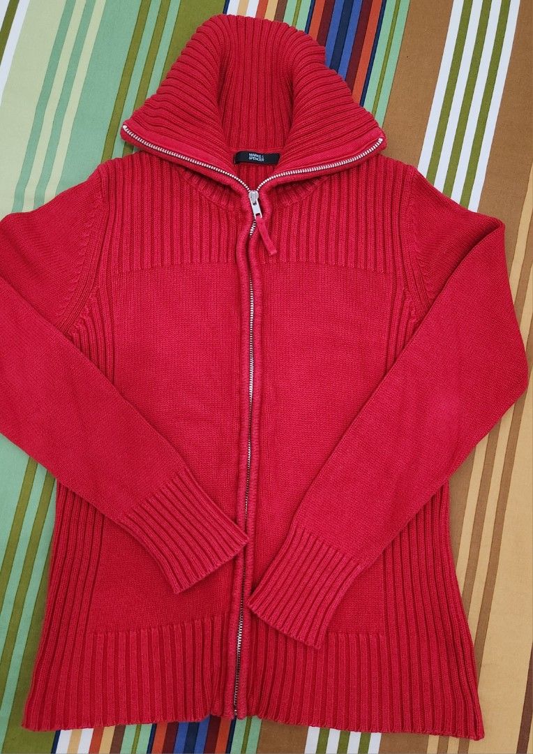 Marks & Spencer Red Zip-Up Knit Cardigan (Category: Coats, Jackets and Outerwear) located in Manila. Submitted by happybear_77e59e777 (Listing ID 1459204004, Image 2). Description: - Red knit cardigan from Marks & Spencer - Full zip-up front with a high collar - Ribbed knit details on sleeves and hem - Comfortable and warm - Ideal for layering - In good condition.