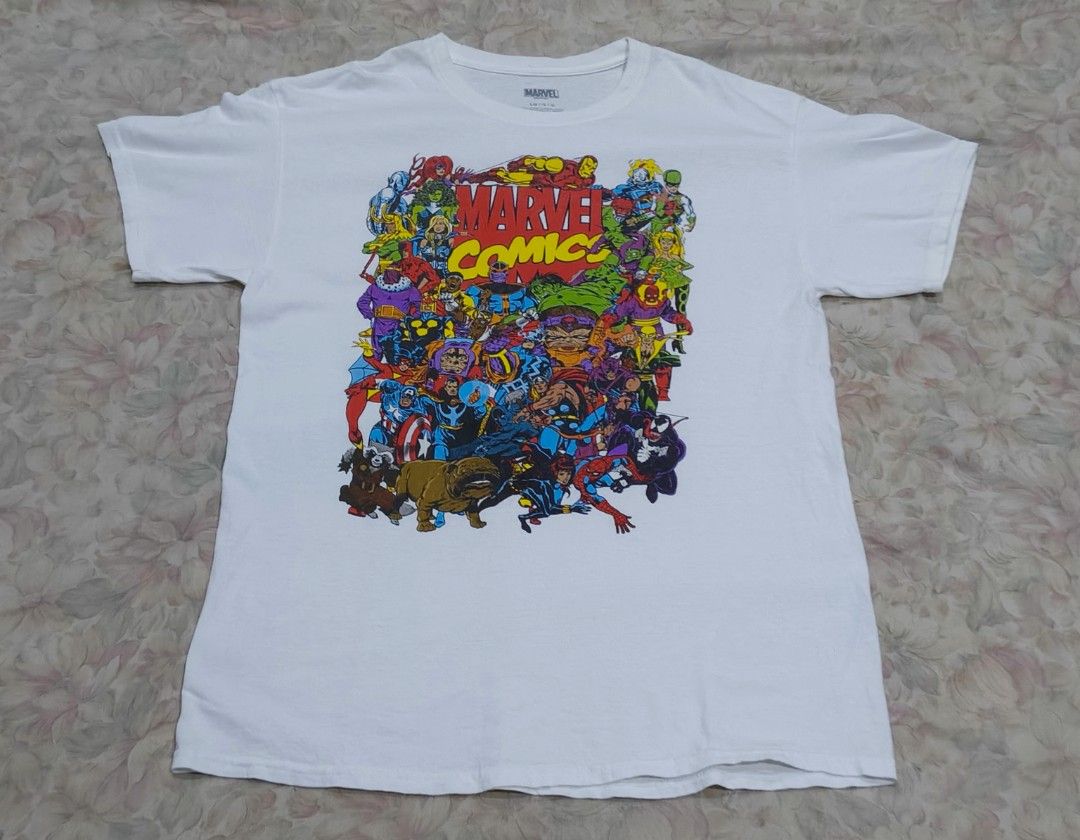 Marvel Comics T-shirt (Category: Formal Shirts) located in Naga. Submitted by makuri_4400 (Listing ID 1459140738, Image 1). Description: Size - L Length - 29.5 Width - 21 Condition - 8.5/10 Color rate - 8/10 Issue -Small tear, Stain, and Loose threads.