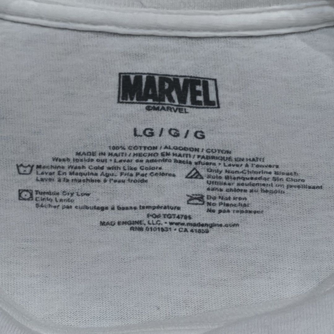 Marvel Comics T-shirt (Category: Formal Shirts) located in Naga. Submitted by makuri_4400 (Listing ID 1459140738, Image 3). Description: Size - L Length - 29.5 Width - 21 Condition - 8.5/10 Color rate - 8/10 Issue -Small tear, Stain, and Loose threads.