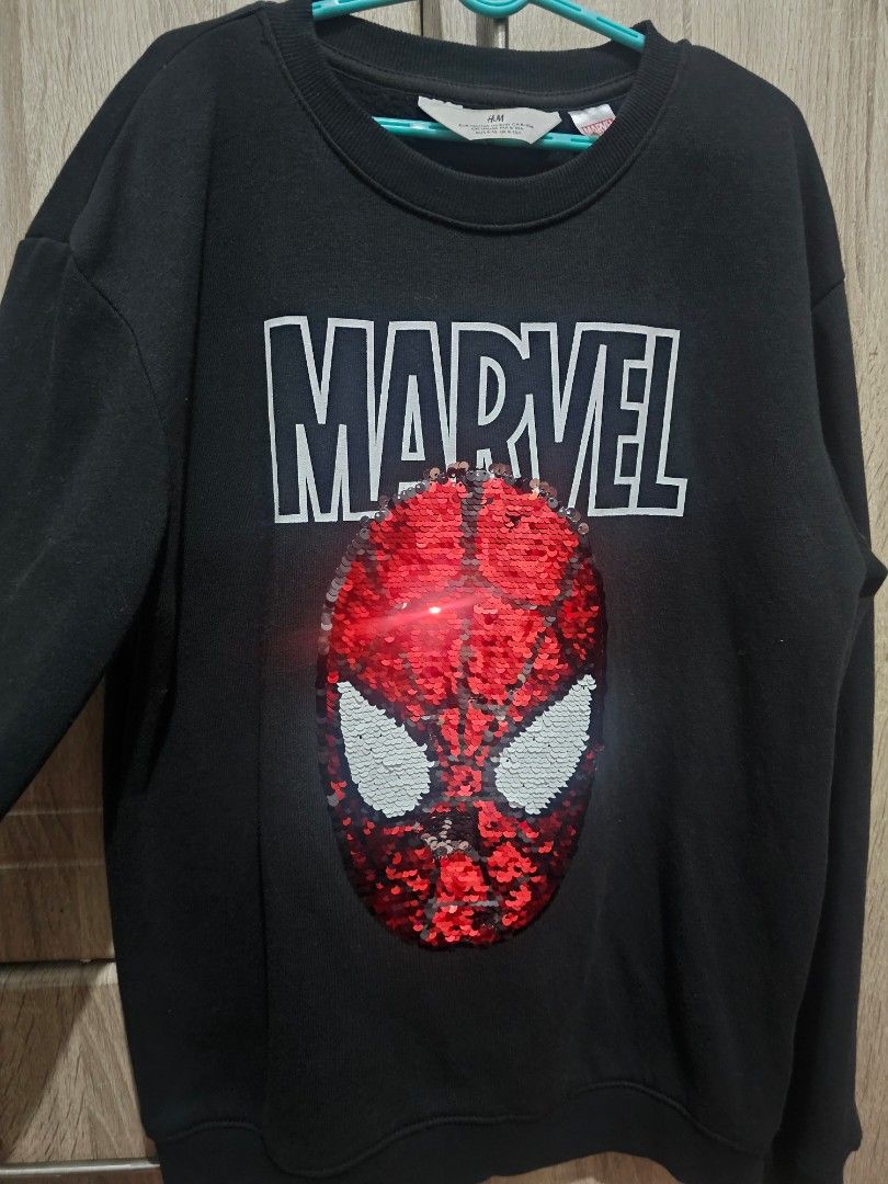 Marvel Spiderman Sequin Sweatshirt (Category: Babies & Kids Fashion) located in Pasig City. Submitted by the_3rd (Listing ID 1459230002, Image 2). Description: - Black Marvel sweatshirt - Features a Spiderman face graphic - Graphic made of red and white sequins - Ideal for any Marvel enthusiast -Bought for 999 at H&M store.