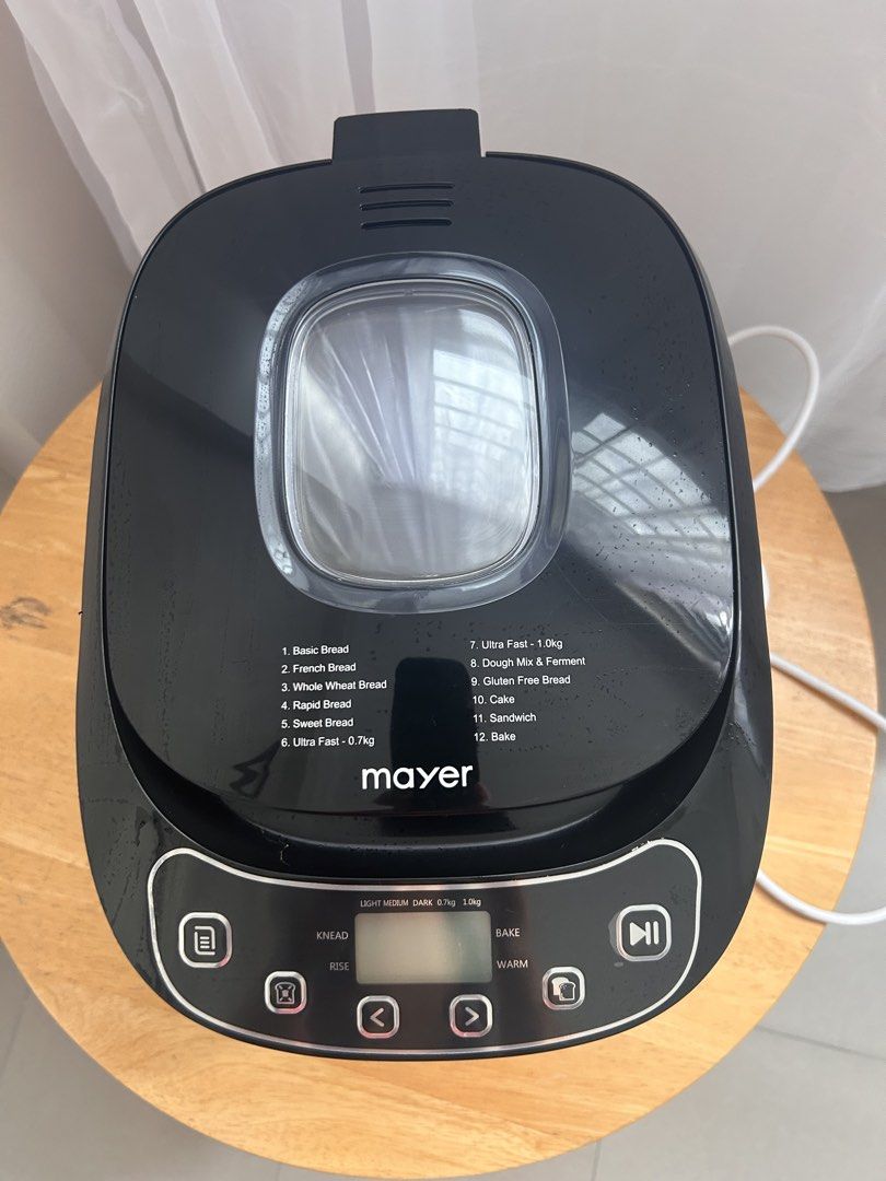 Mayer Bread Maker - 12 Programs (Category: Breadmakers) located in Singapore. Submitted by rosbeth (Listing ID 1459103470, Image 2). Description: - Mayer Bread Maker - 12 Versatile Programs: Basic, French, Whole Wheat, Rapid, Sweet, Ultra Fast, Dough Mix, Gluten-Free, Cake, Sandwich, Bake - Loaf Sizes: 1 kg - Crust Options: Light, Medium, Dark - User-Friendly Control Panel.
